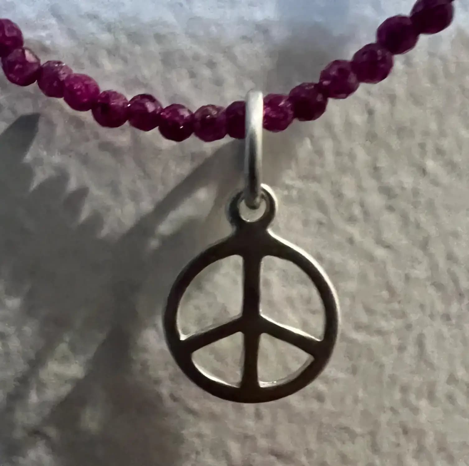 RUBY NECKLACE WITH PEACE PENDANT