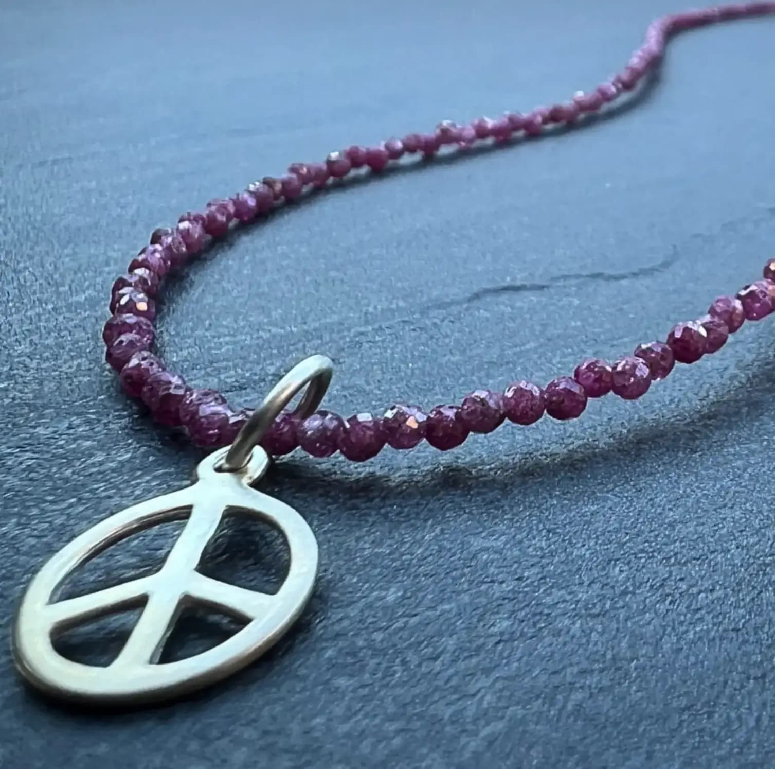 RUBY NECKLACE WITH PEACE PENDANT
